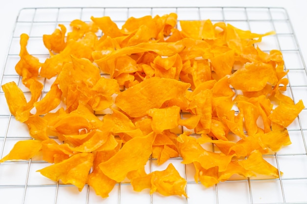 Sweet potato chips on white background.