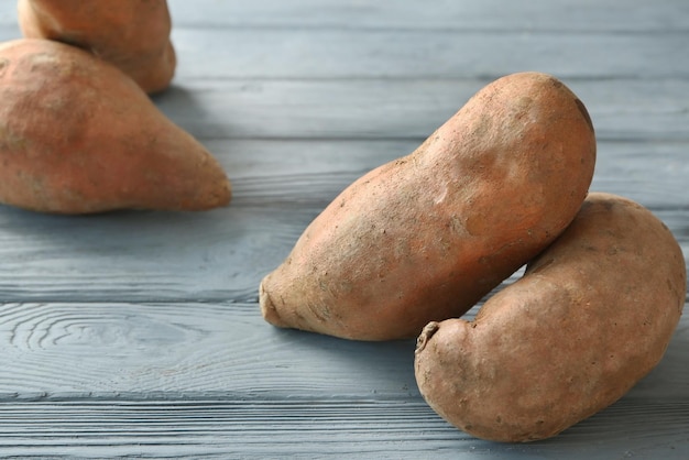 Sweet potatoes on wooden table