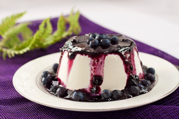 Sweet pudding with blueberry confiture