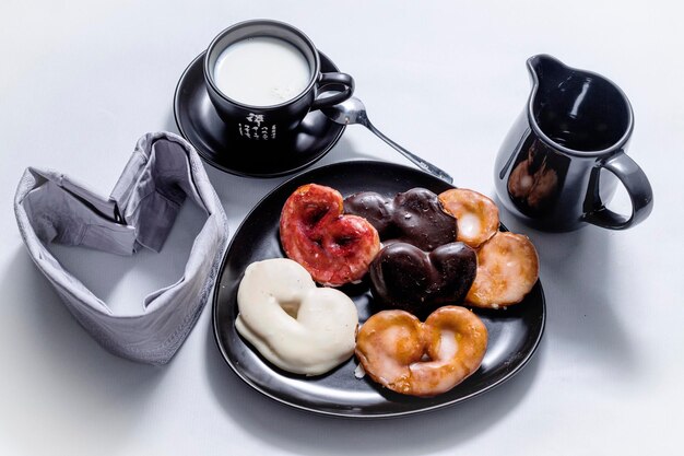 sweet puff pastry and wet chocolate in cup of milk