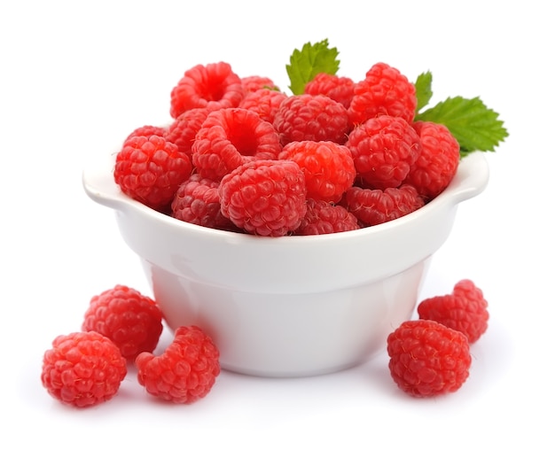 Sweet raspberry with leaves on white