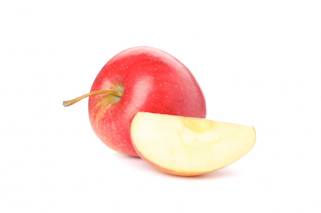 Sweet red apple on white table