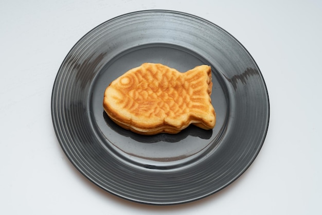 Sweet red bean bread in the shape of a crucian carp in a bowl