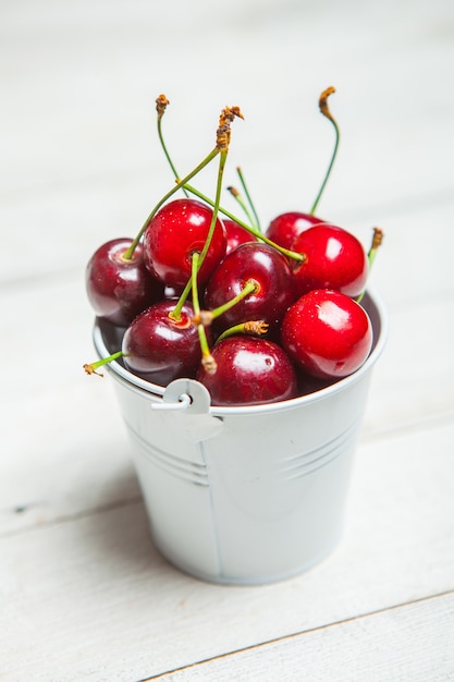 Sweet red cherries isolated on white surface