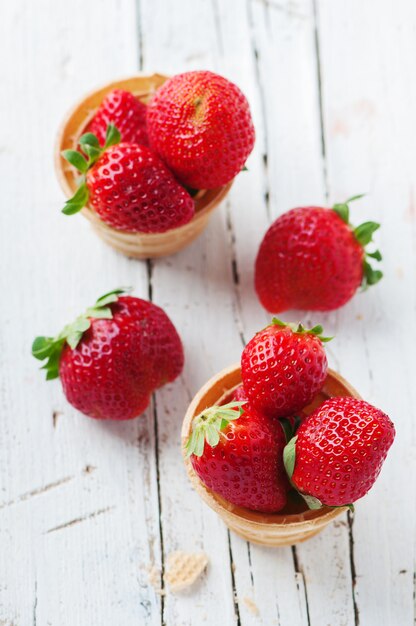 Sweet red strawberries inside ice cream cones