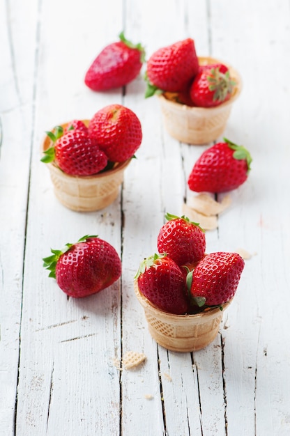 Sweet red strawberries inside ice cream cones