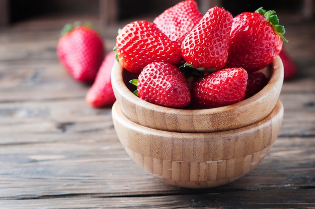 Sweet red strawberry on the wooden table