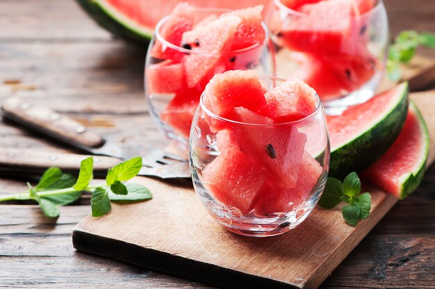 Sweet red watermelon and mint on the wooden table