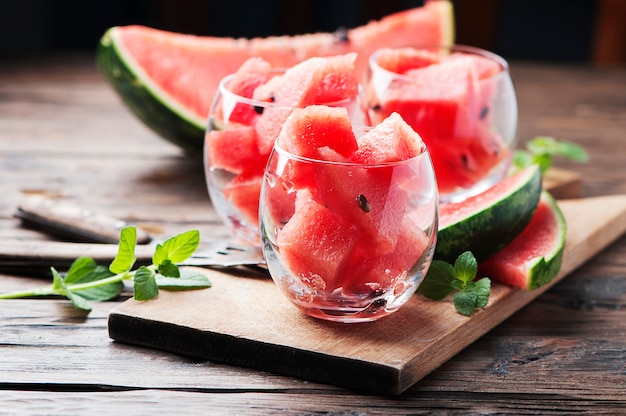 Sweet red watermelon and mint on the wooden table