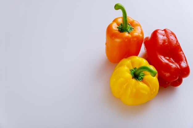 Sweet red, yellow and red bell pepper. Copy space.