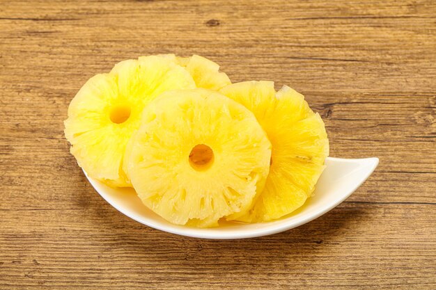 Sweet ripe pineapple rings in the bowl