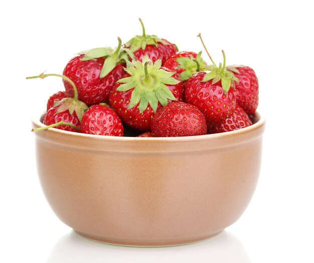 Sweet ripe strawberries in glass bowl isolated on white