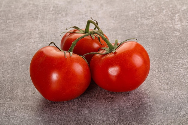 Sweet ripe tomatoes on the branch