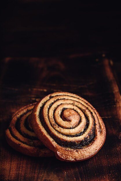 Photo sweet roll with poppy seeds