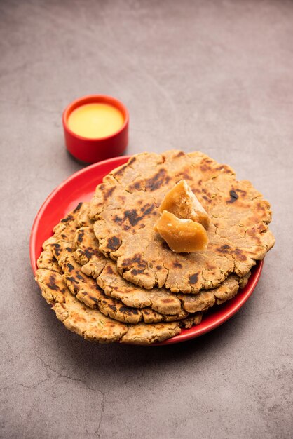 Sweet roti made out of rice flour jaggery and ghee Gud ki roti gur ki roti jaggery Bhakri meethi gud ki roti Winter food Copy space