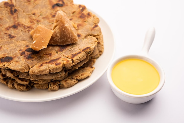 Sweet roti made out of rice flour jaggery and ghee Gud ki roti gur ki roti jaggery Bhakri meethi gud ki roti Winter food Copy space