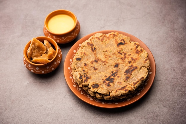 Sweet roti made out of rice flour jaggery and ghee Gud ki roti gur ki roti jaggery Bhakri meethi gud ki roti Winter food Copy space