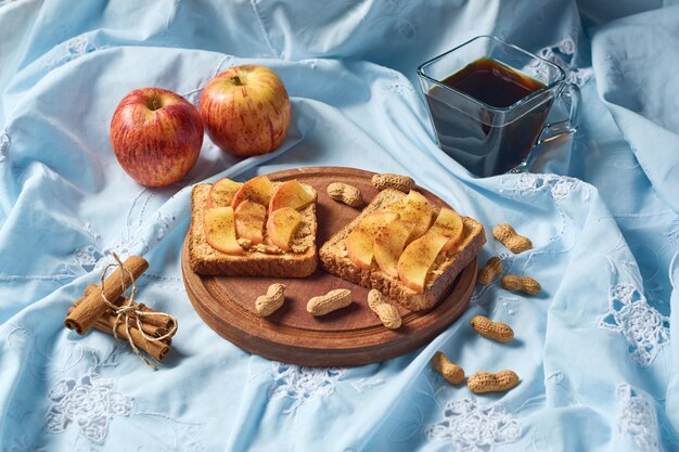 Sweet sandwich with peanut butter and apple Healthy vegetarian dessert