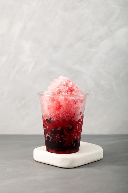 Sweet shaved ice with tapioca pearls Take away street food Fruit berries cocktail Bubble tea