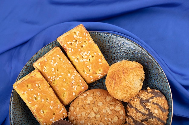 Sweet snacks placed on a stone table .