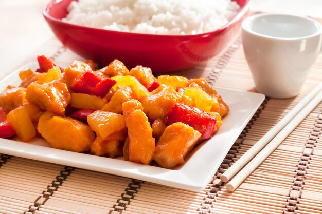 Sweet and sour chicken with bell pepper and pineapple.
