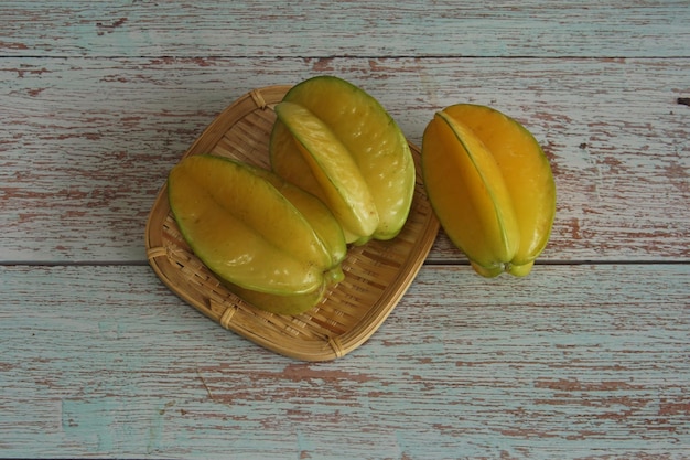 Sweet starfruits on wooden background
