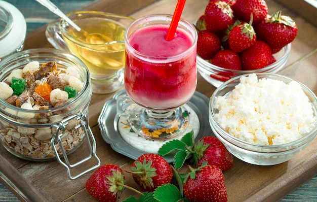 Sweet strawberry and healthy smoothies on the table.