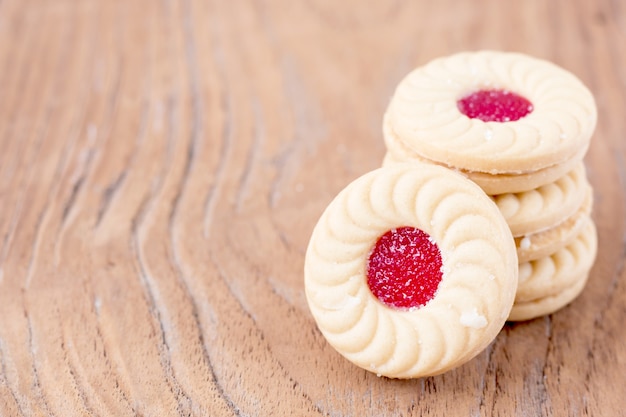 sweet strawberry inside cookie on wood background. 