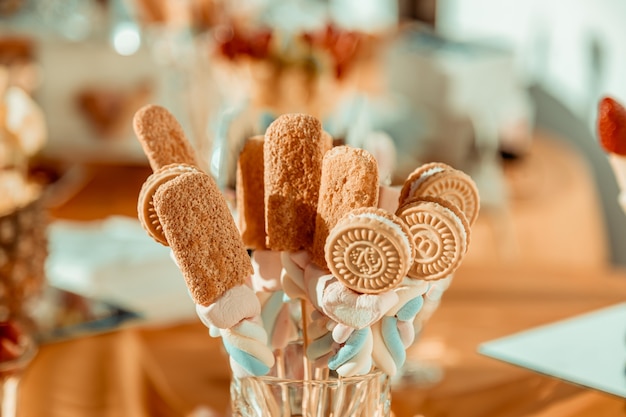 Sweet table with candies and cookies