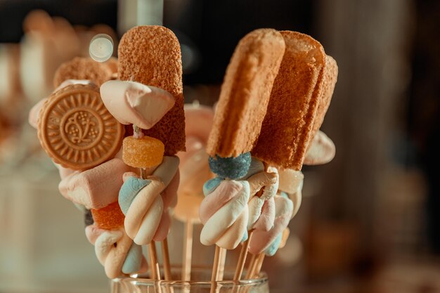 Sweet table with candies and cookies