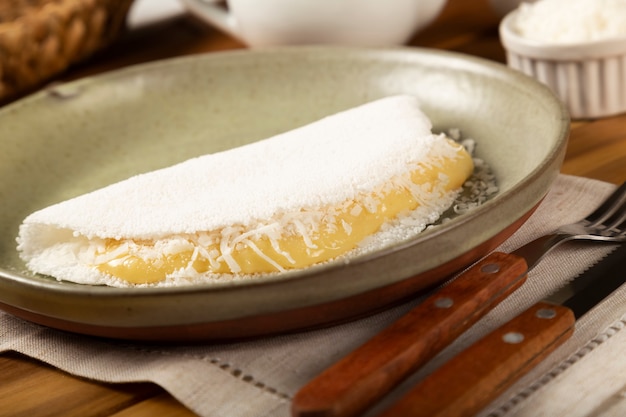 Photo sweet tapioca stuffed with coconut cream. brazilian tapioca.