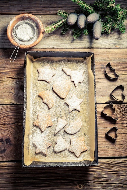 Sweet and tasty Christmas gingerbread cookies on wooden table