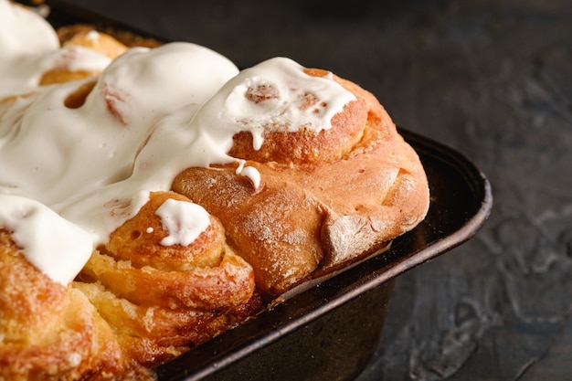 Sweet tasty homemade rose buns rolls with sugar whipped cream, hot and fresh, bakery for recipe book, angle view