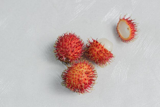 Sweet tropical fruit rambutan on a white background.