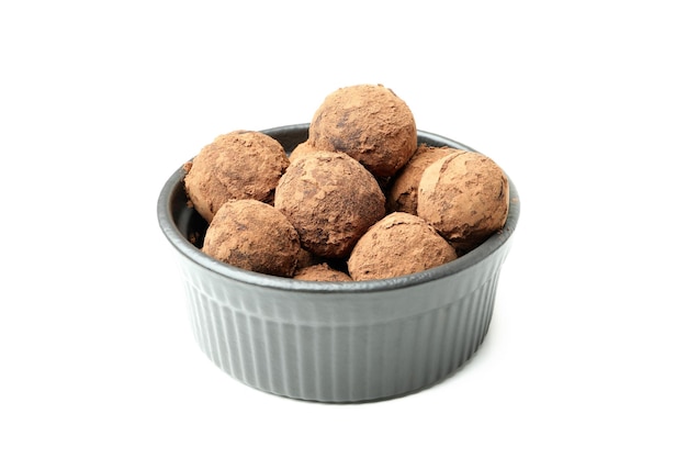 Sweet truffles in bowl isolated on white background