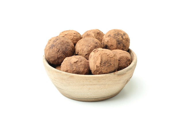 Sweet truffles in bowl isolated on white background