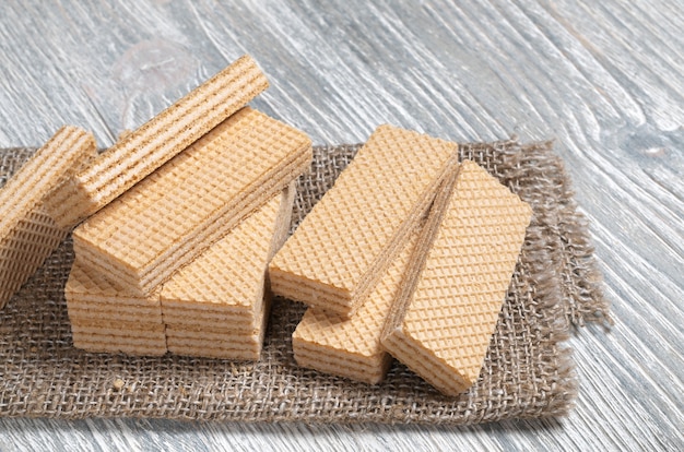 Sweet wafers on a burlap on wooden table