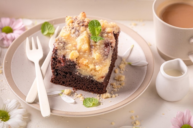 Sweet yeast cake with icing and fruits