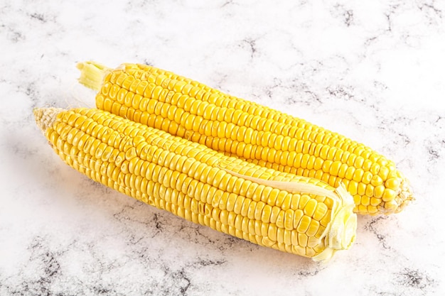 Sweet yellow raw ripe corn cob