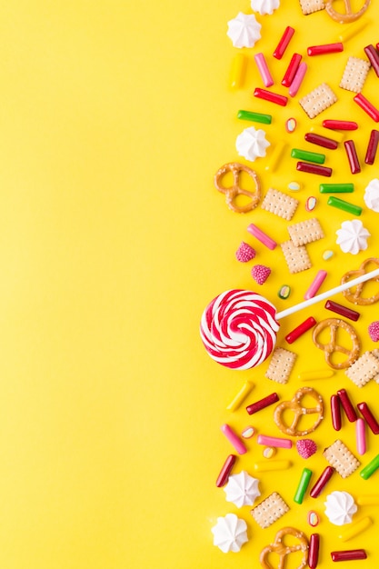 Sweets flat lay on yellow background