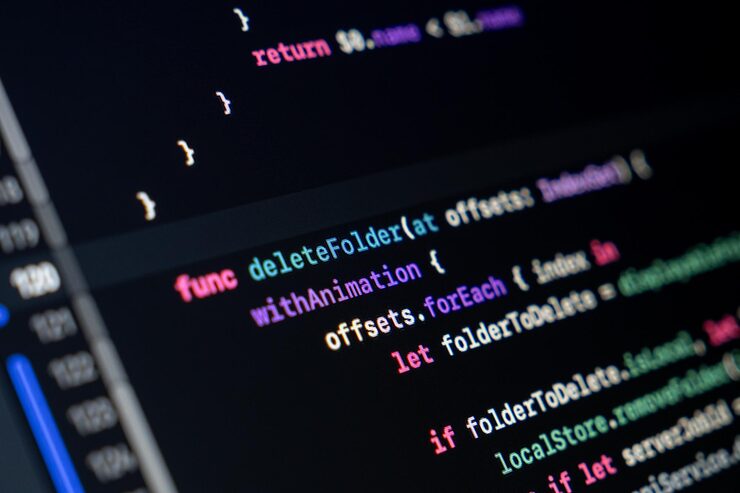 Photo swift function code on screen showing folder deletion logic with animation and loop structure
