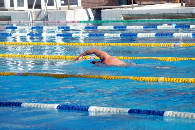 Swimmer in the big outdoor swimming pool