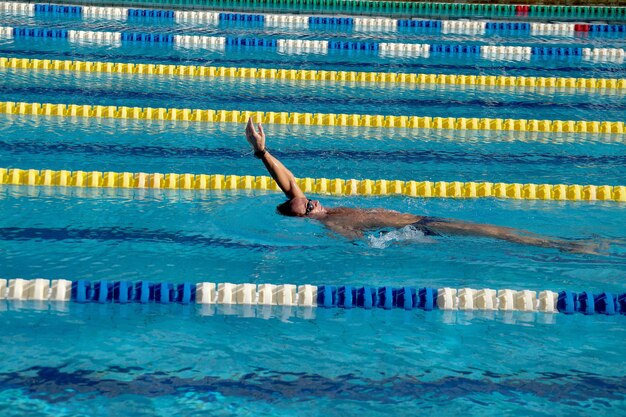 Swimmer in the big outdoor swimming pool