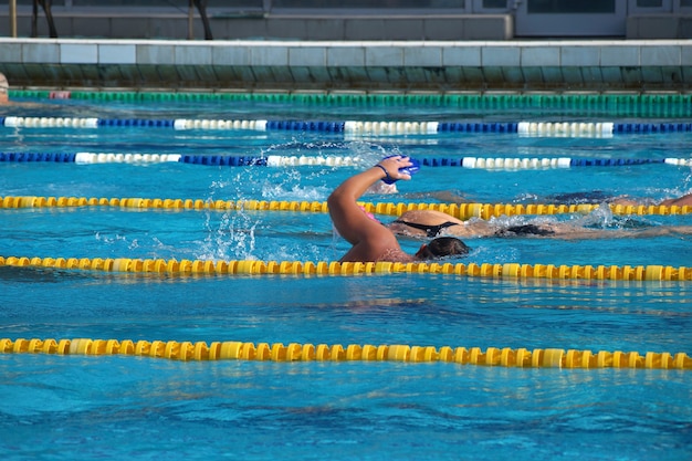 Swimmer in the big outdoor swimming pool