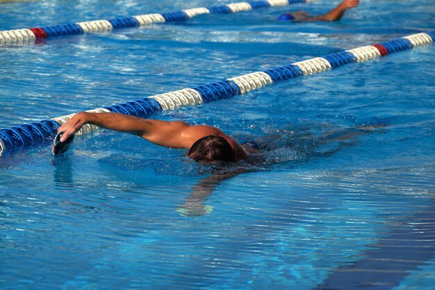 Swimmer in the big outdoor swimming pool