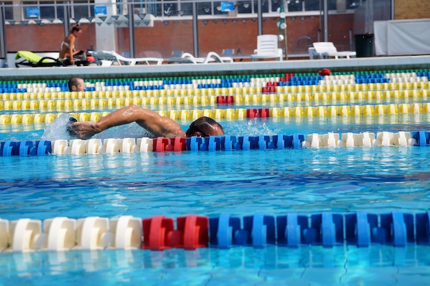 Swimmer in the big outdoor swimming pool