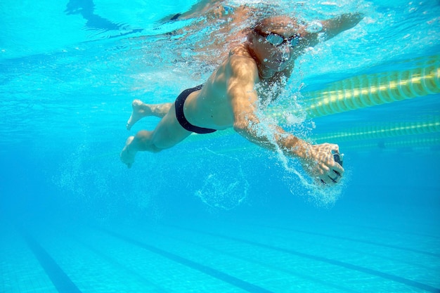 Swimmer in the big outdoor swimming pool