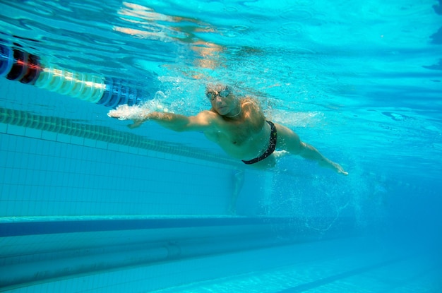 Swimmer in the big outdoor swimming pool