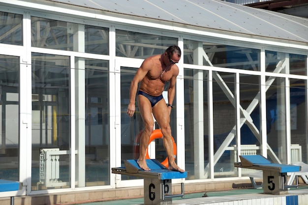 Swimmer in the big outdoor swimming pool