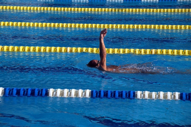 Swimmer in the big outdoor swimming pool